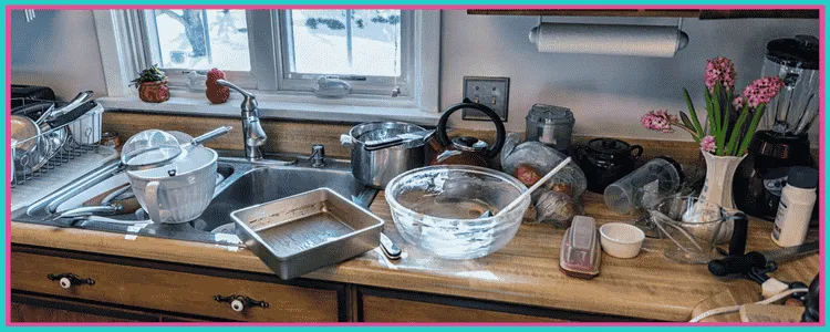 An image demonstrating that even the best recipes come from a messy kitchen. It's a picture of a kitchen counter with cooking tools and food all over it.